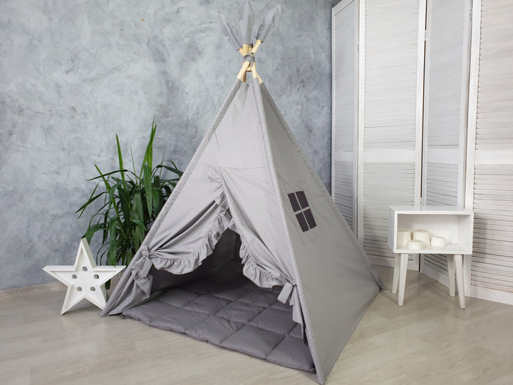 Cozy reading nook tent in soft gray tones Gray Minimalist Kids Teepee Tent | Neutral Cotton Play Tent for Boys and Girls | Montessori Indoor Playhouse | Toddler Gift Idea hellolittlefox gray-teepee-tent-with-ruffles hellolittlefox.myshopify.com Gray Minimalist Kids Teepee Tent | Neutral Cotton Play Tent for Boys and Girls | Montessori Indoor Playhouse | Toddler Gift Idea hellolittlefox gray-teepee-tent-with-ruffles hellolittlefox.myshopify.com