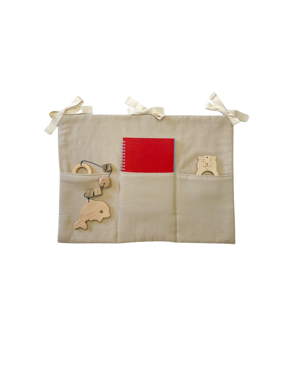 Neutral beige linen crib pocket organizer with three compartments