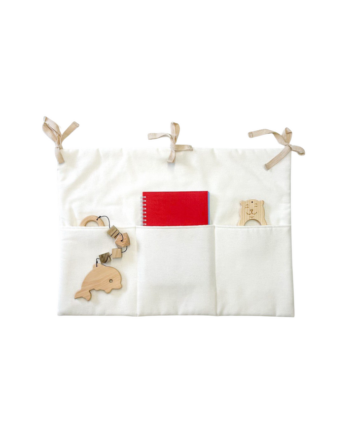 White linen crib organizer with three storage pockets and tie straps Linen toy pocket | White hellolittlefox linen-toy-pocket-white hellolittlefox.myshopify.com