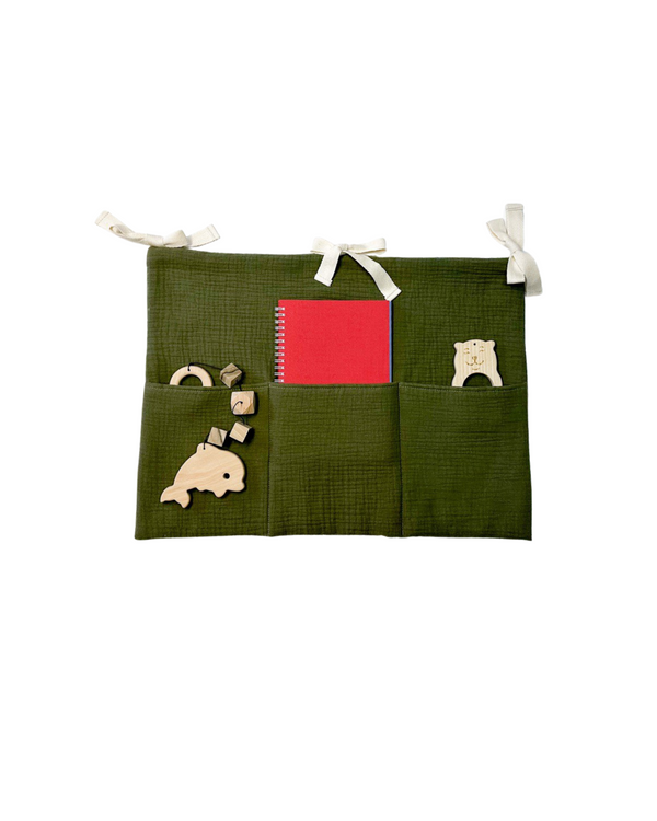 Khaki cotton muslin toy pocket with three compartments for crib or nursery storage