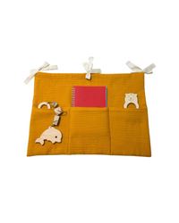 Mustard yellow muslin toy pocket with 3 compartments for crib or nursery storage Muslin toy pocket | Mustard hellolittlefox muslin-toy-pocket-mustard hellolittlefox.myshopify.com
