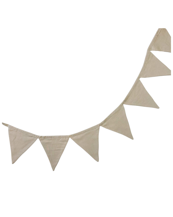 Beige linen bunting garland hanging above a nursery crib with natural decor