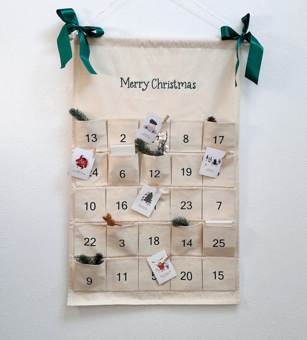 A fabric Advent calendar with pockets numbered 1 to 25