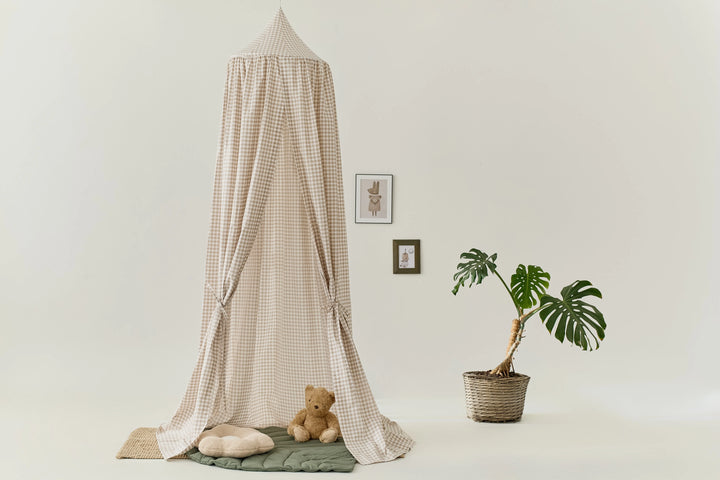 Toddler bed with hanging gingham canopy for reading nook