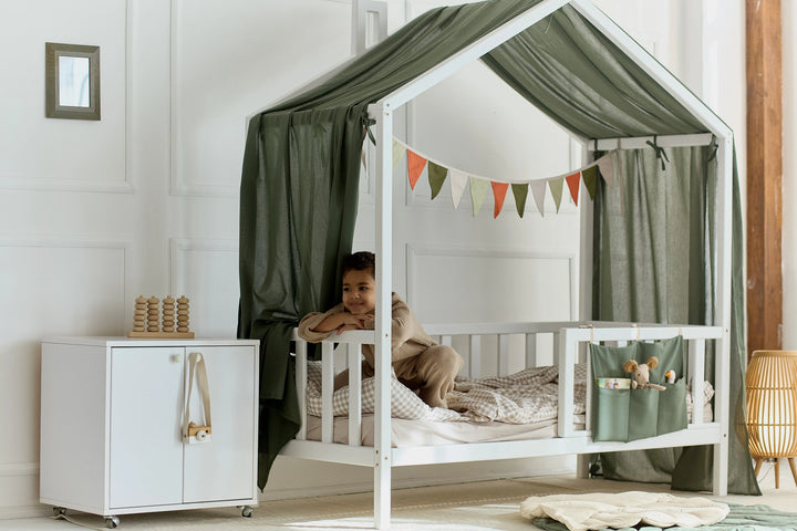 Soft khaki canopy creating a cozy reading nook for kids Khaki Linen Baby Canopy Bed Curtains – Breathable Linen Curtains for Montessori & House Bed Setups hellolittlefox khaki-linen-baby-canopy-new-bed-curtains-perfect-for-montessori hellolittlefox.myshopify.com