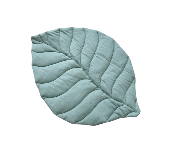Sage green linen leaf-shaped play mat for nursery or baby playroom