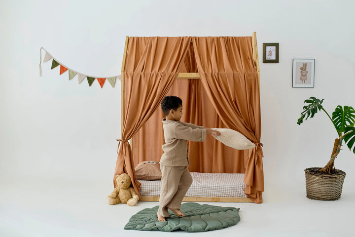 Boho-style kids room with terracotta canopy drapes Terracotta Linen Bed Curtains for Montessori House Bed | Organic Linen Canopy Curtains for Toddler or Twin Bed hellolittlefox khaki-linen-bed-curtains-for-montessori-house-bed-organic-linen-canopy-curtains-for-toddler-or-twin-bed-copy hellolittlefox.myshopify.com