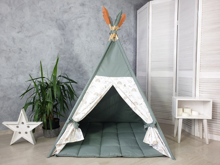 Dusty green color and rainbow print teepee with mat and stars made with cotton fabric and wooden sticks.Fluffy mat and feathers are included. Wooden sticks and fixing kit are included.