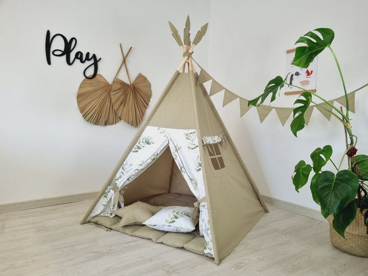 Indoor playzone for kids with olive green teepee tent and neutral print