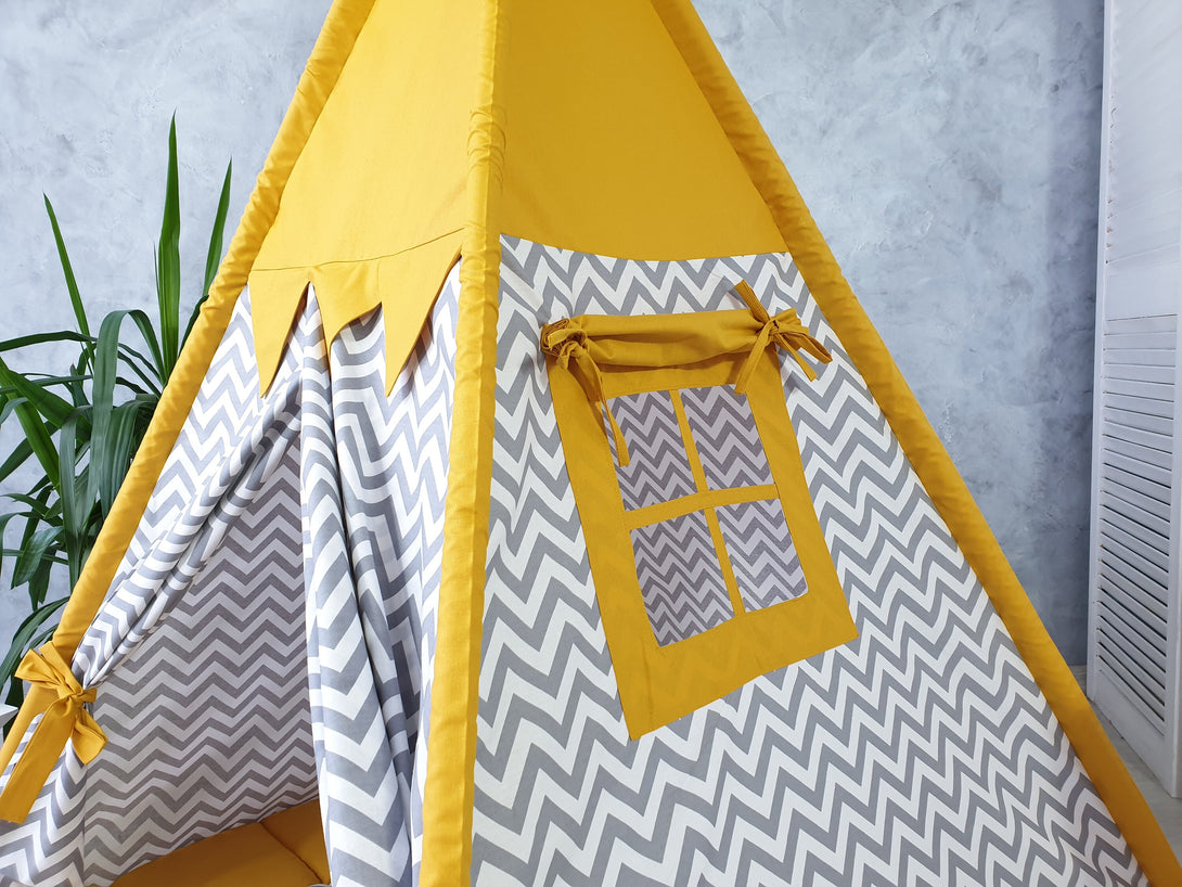 Indoor playzone with mustard color teepee for kids, neutral print playhouse