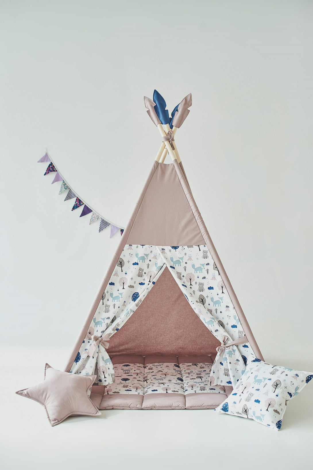 Neutral teepee print indoor playzone with dusty brown woodland print for kids