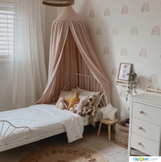 A Beige muslin canopy, gently billowing in the breeze, creating a tranquil oasis in the room