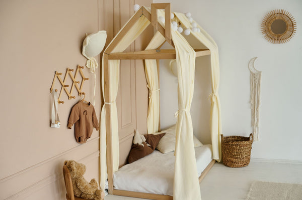 Transform your toddler sleep space into a cozy haven with our Muslin Canopy, perfect for creating a Montessori inspired reading nook or a whimsical baby bed canopy.