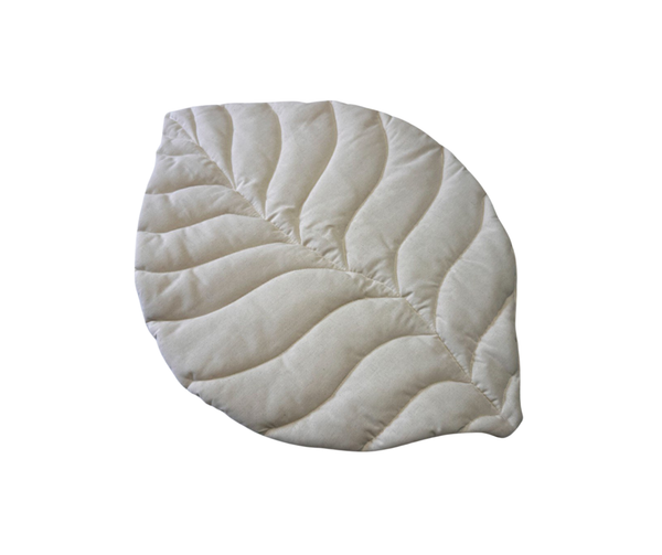 Off-white linen leaf-shaped baby play mat for neutral nursery decor